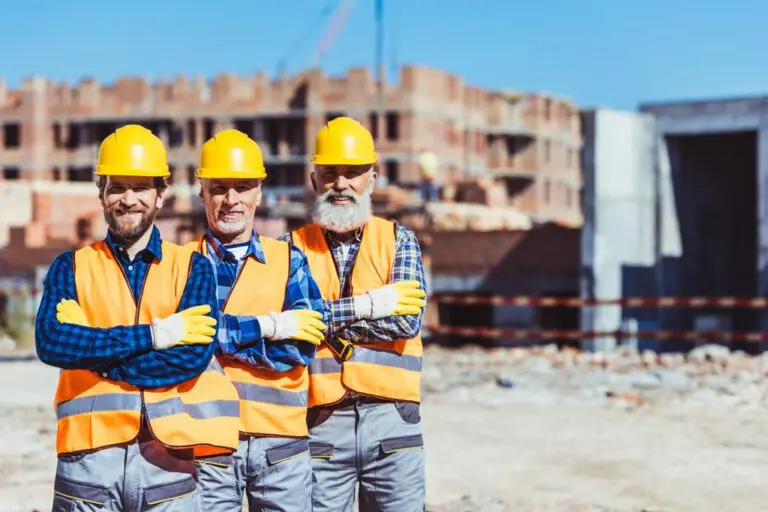 Work crew together on a construction site in uniforms